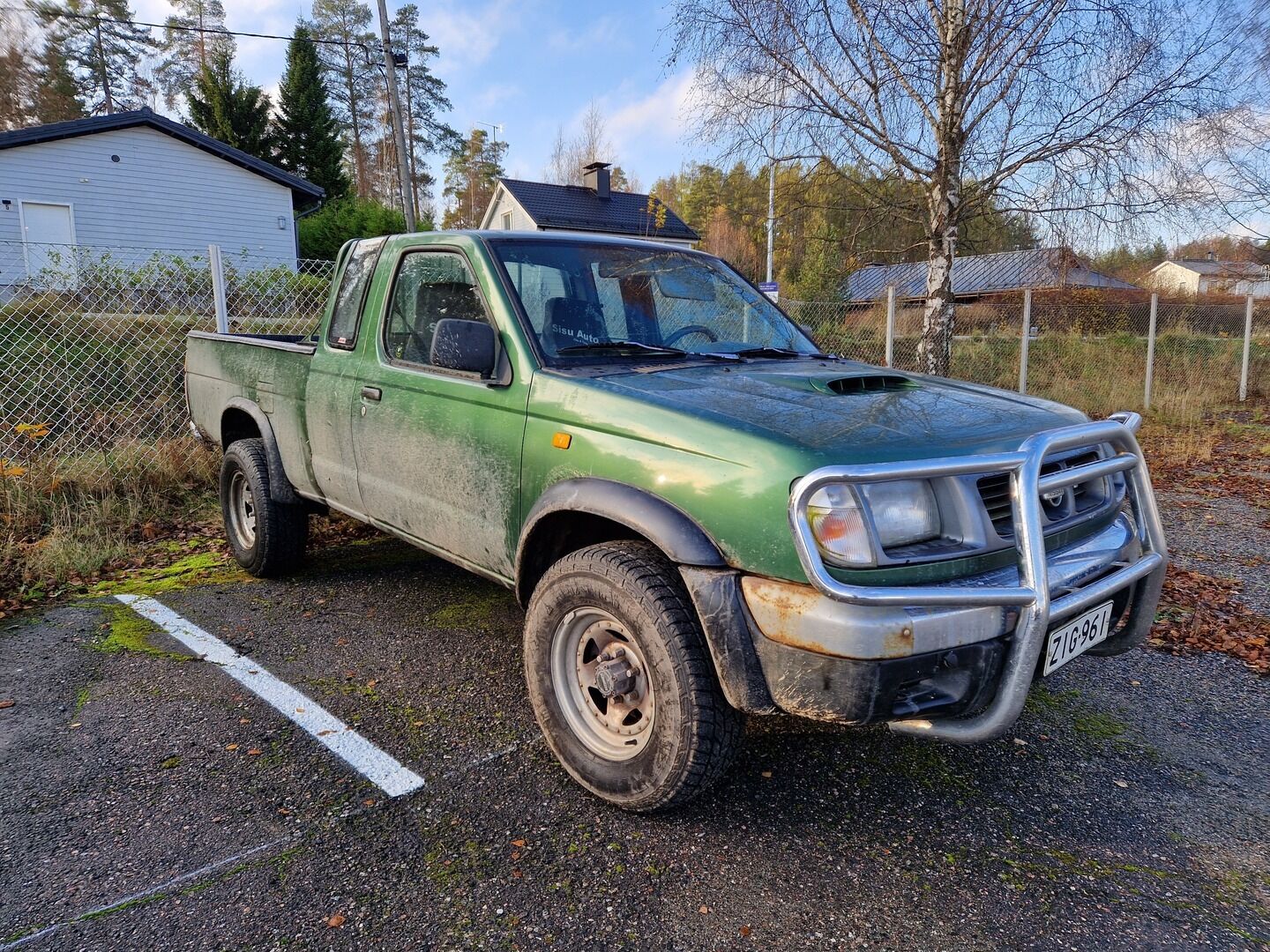 Vihreä Nissan Cab